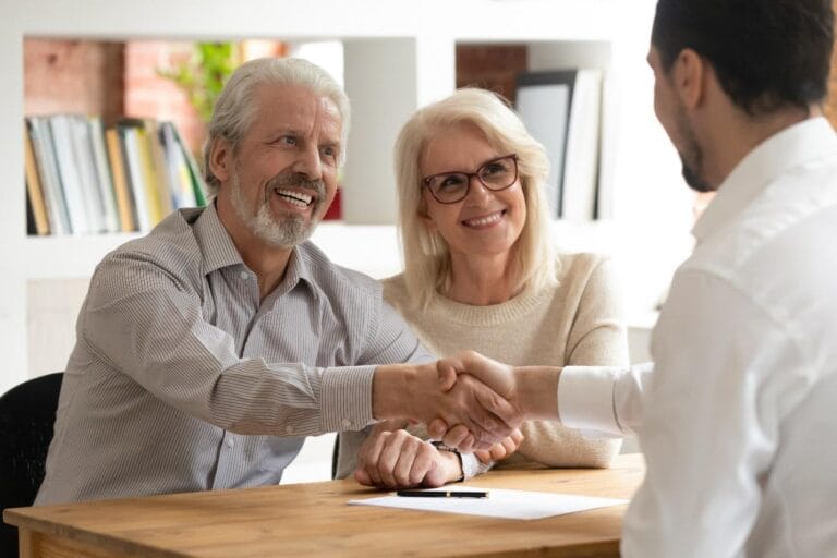 Man shaking hands with consultant.